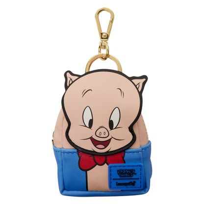 Porky Pig keychain bag with a gold clasp at the top. The bag is light pink on the upper portion and bright blue on the lower portion, with a red bow tie detail and a blue patch that reads 'Looney Tunes'.