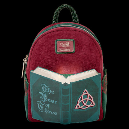 Glowing Red and green Loungefly Paramount Charmed Light-Up Mini Backpack with book design and 'The Power of Three' text on a white background