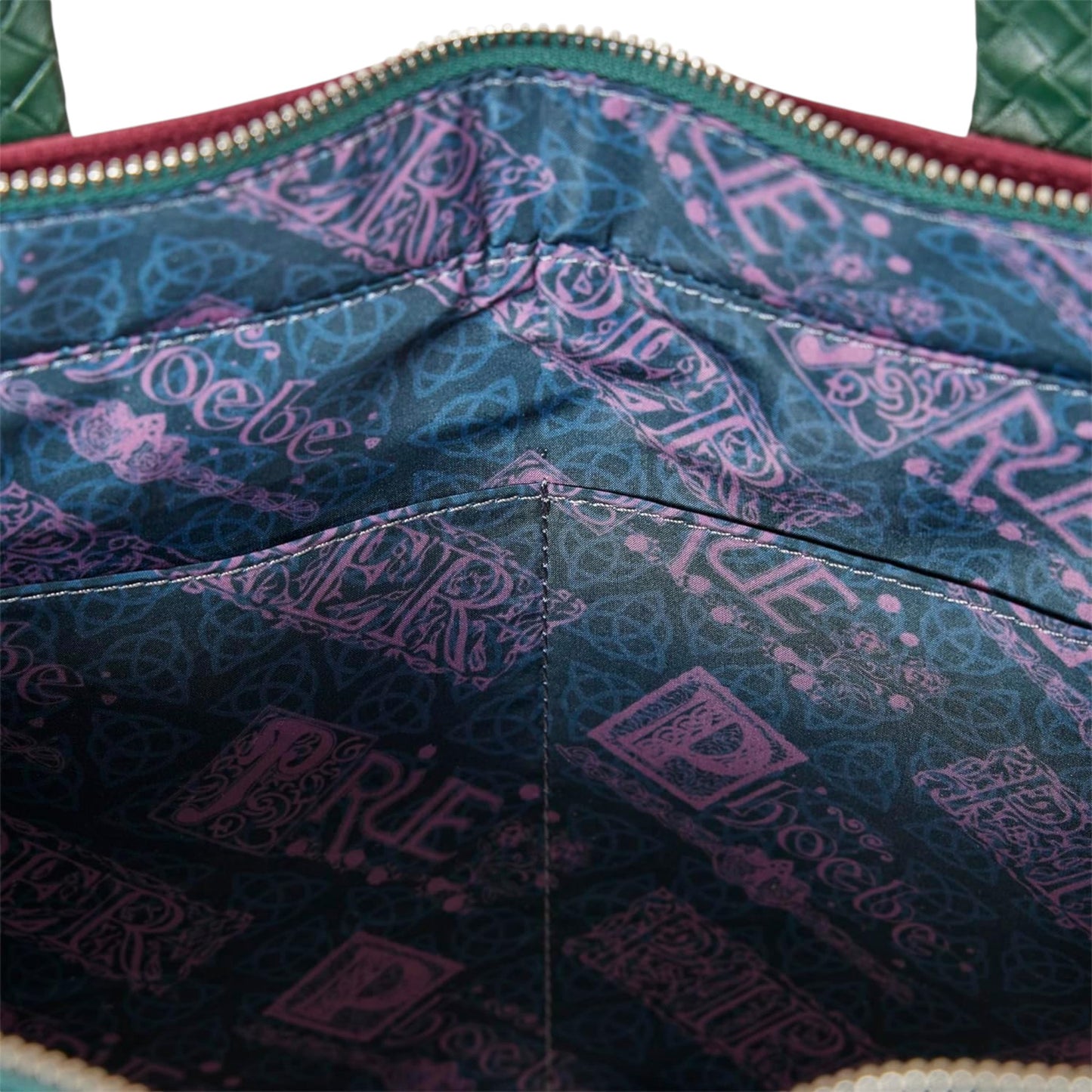 Close-up of inside of Red and green Charmed Power of Three Convertible Backpack & Tote Crossbody Bag  symbols with visible branding