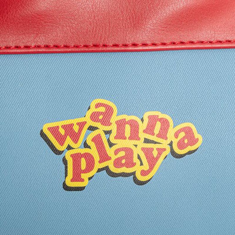 Close-up of Loungefly Child's Play Chucky Cosplay Mini Backpack with 'wanna play' text on a blue background with red border
