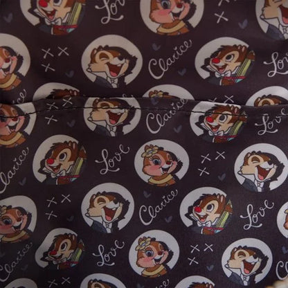 Close-up of inside of Loungefly New Chip 'n' Dale Two Chips and a Miss Mini Backpack with Chip and Dale character face patterns wearing tuxedos 