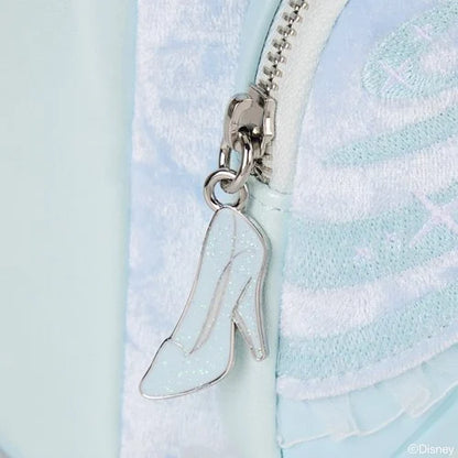 Close-up of a high-heeled shoe zipper charm on a Cinderella Mini Backpack with Disney logo.