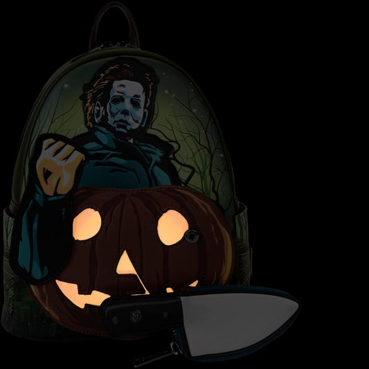 Glowing Michael Myers Pumpkin Glow Mini Backpack design featuring a Michael Myers character with an knife on a black background