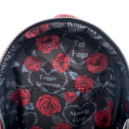 Inside of Loungefly Dark Romance Mini Backpack with red roses and 'Red Roses', Trigger Warning', Morally Grey' and Dark Romance' text on a black background