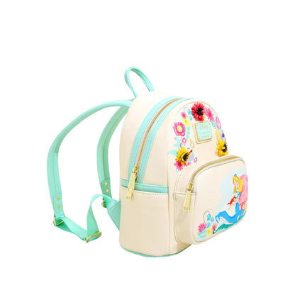Alice in Wonderland Garden Flowers Mini Backpack with Alice character design laying against a mushroom with floral elements on a white background
