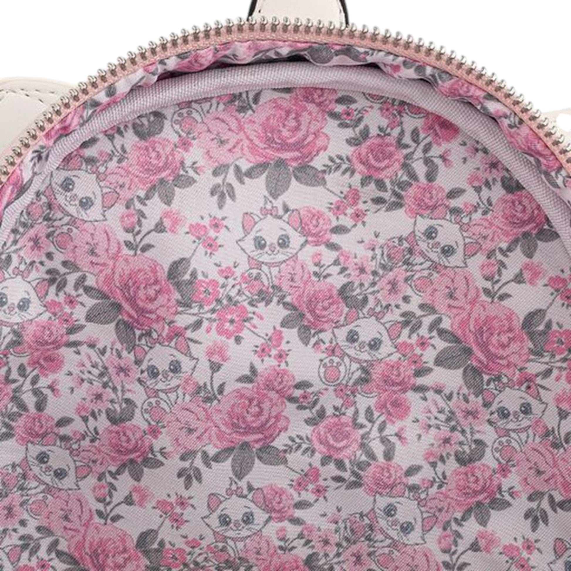 Inside of Loungefly Disney Aristocats Marie Floral Footsy Mini Backpack  with Marie character face and floral patterned fabric on a white background