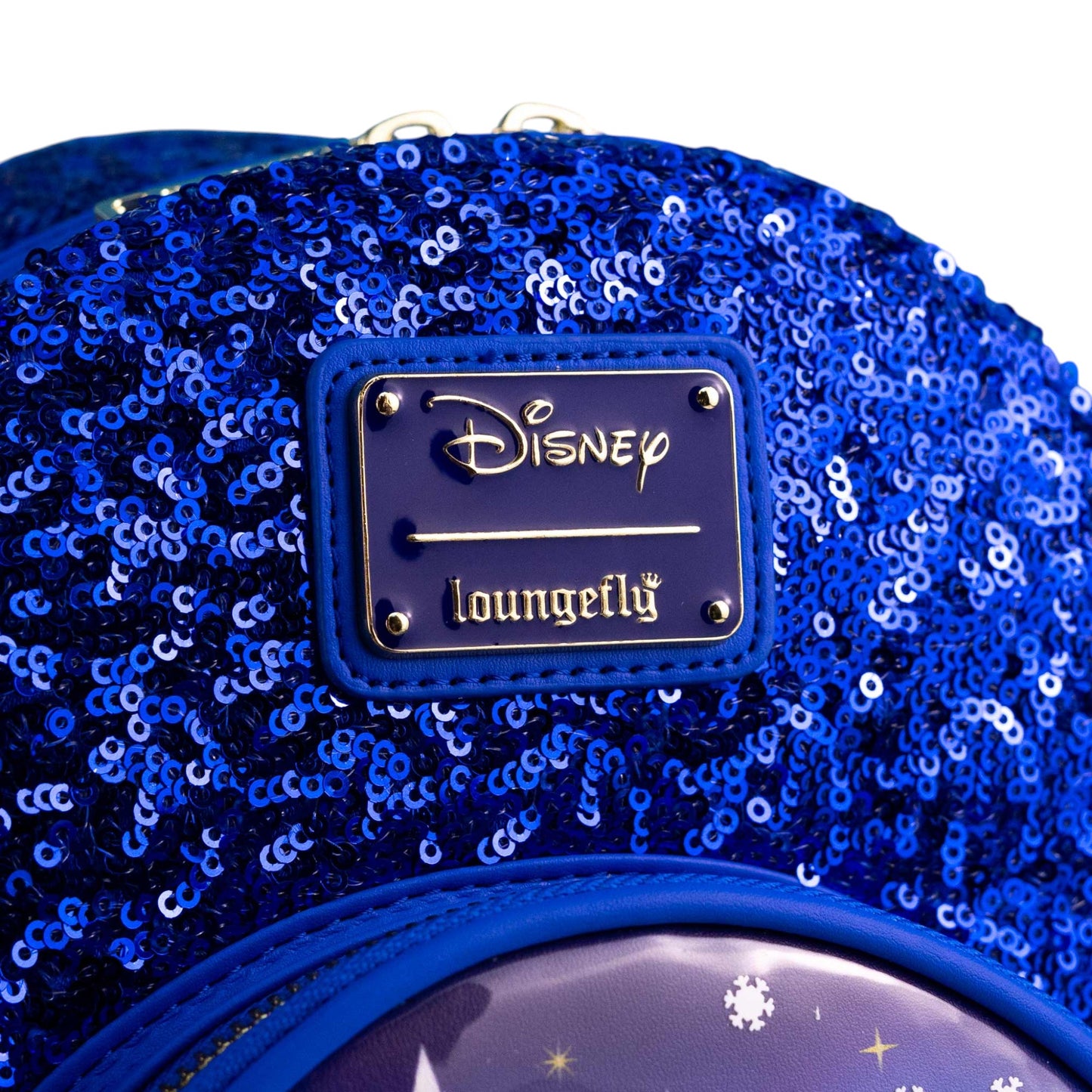 Close-up of Loungefly Disney Cinderella Castle Snow Globe Sequin Mini Backpack with with branded Disney Loungefly logo on a white background