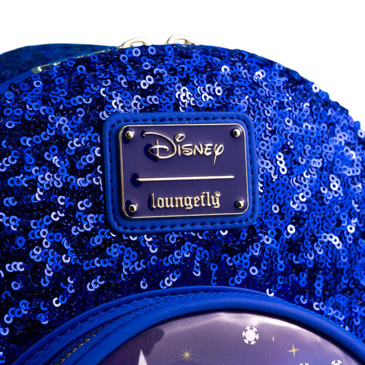 Close-up of Loungefly Disney Cinderella Castle Snow Globe Sequin Mini Backpack with with branded Disney Loungefly logo on a white background