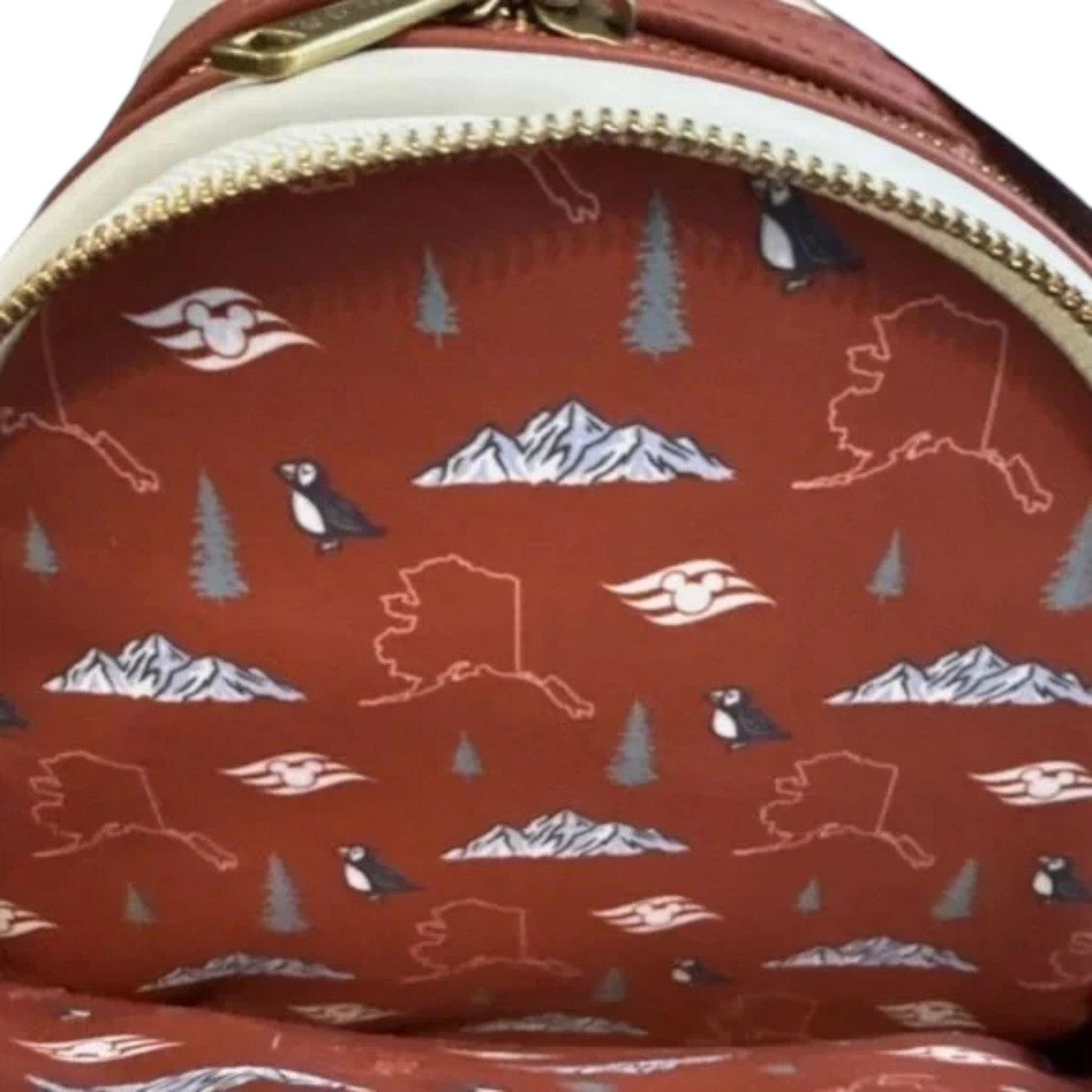 Inside of Loungefly Disney Cruise Line Alaska Minnie Mouse Mini Backpack with nature-themed Alaskan pattern featuring mountains, trees, and animals.