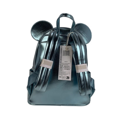 Metallic green and purple backpack with tag on a white background