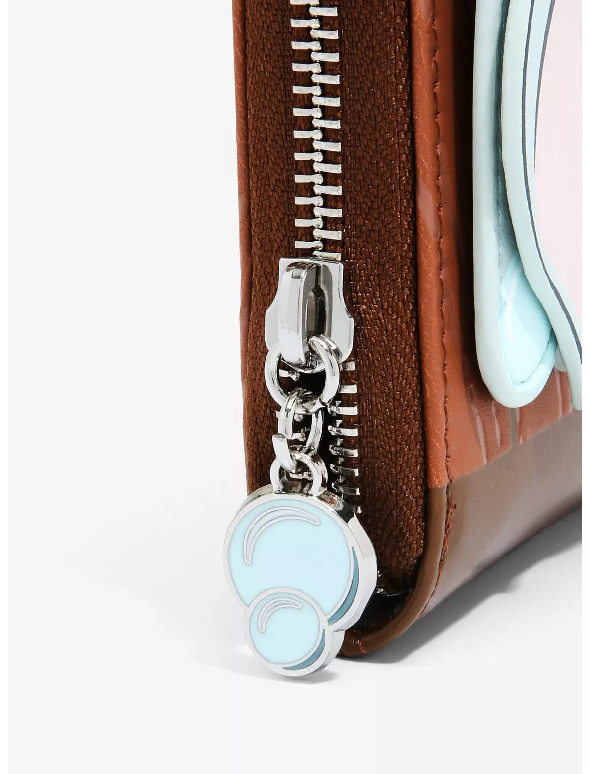 Close-up of Loungefly Disney Dumbo Bath Small Zip Wallet with a silver zipper and a blue circular charm.
