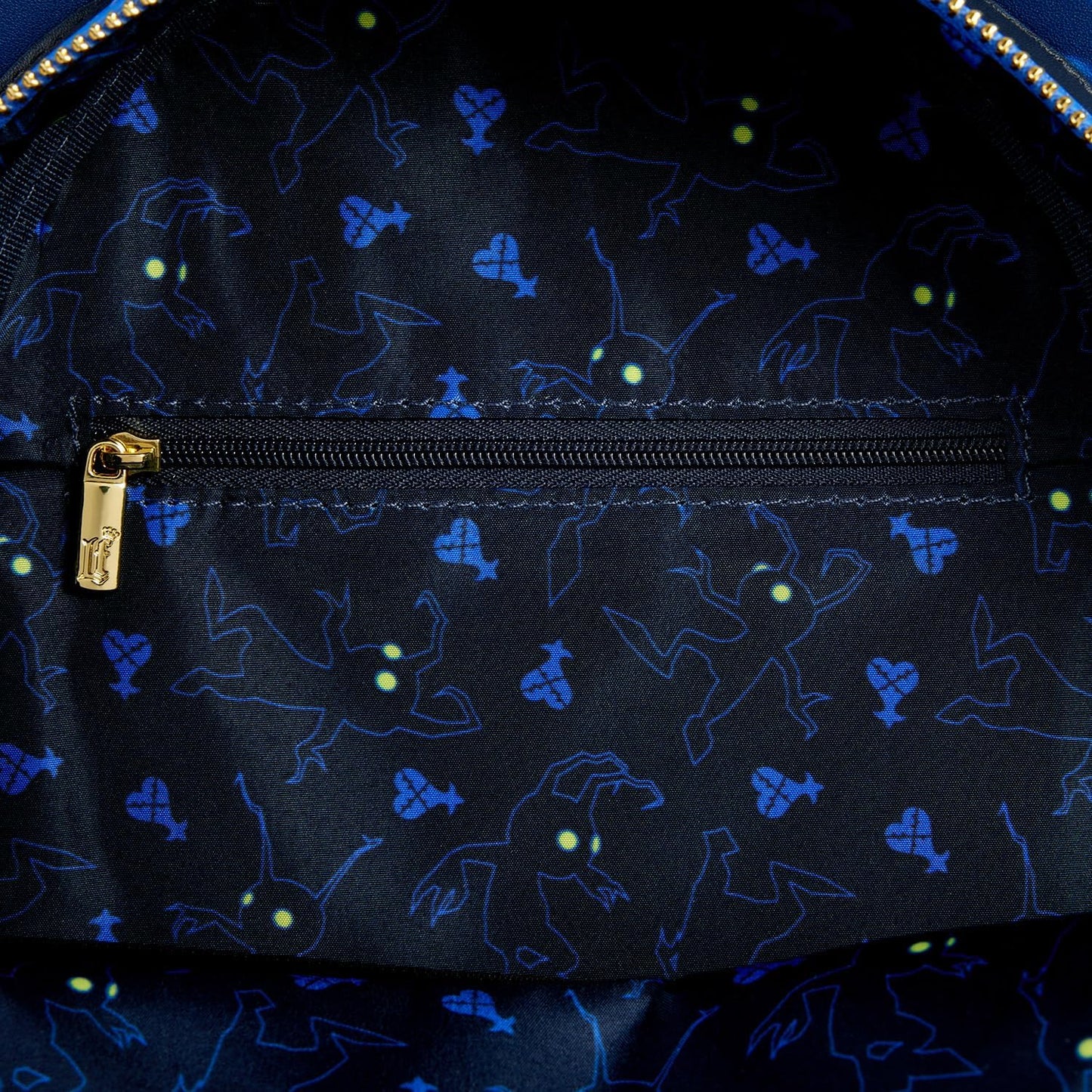 Kingdom Hearts Mickey Mini Backpack with Dark fabric with blue character patterns and gold zipper pull