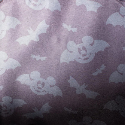Pattern of mickey mouse head bats on a dark background