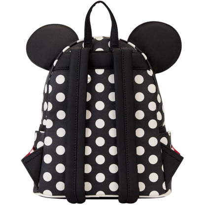 Black and white polka dot backpack with Minnie Mouse ears on a white background