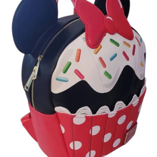 Minnie Mouse Sprinkle Cupcake Backpack designed like a cupcake with blue ears and a red bow on a white background