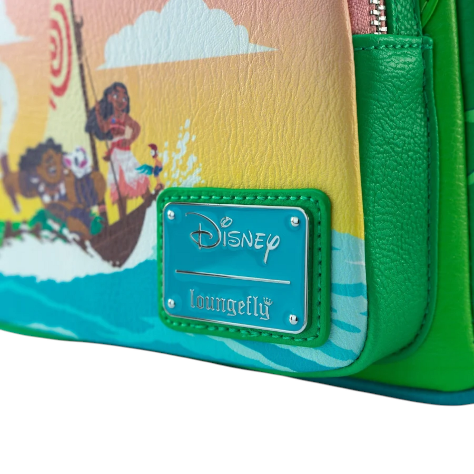 Close-up of Loungefly Disney Moana Te Fiti Cosplay Mini Backpack with Te Fiti face and Moana, Maui, Hei Hei and Pua riding on a raft and ' Disney loungefly' branding.