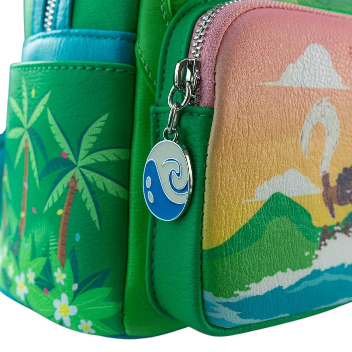 Close-up of Loungefly Disney Moana Te Fiti Cosplay Mini Backpack with a blue and white zipper charm with symbol on it on a white background