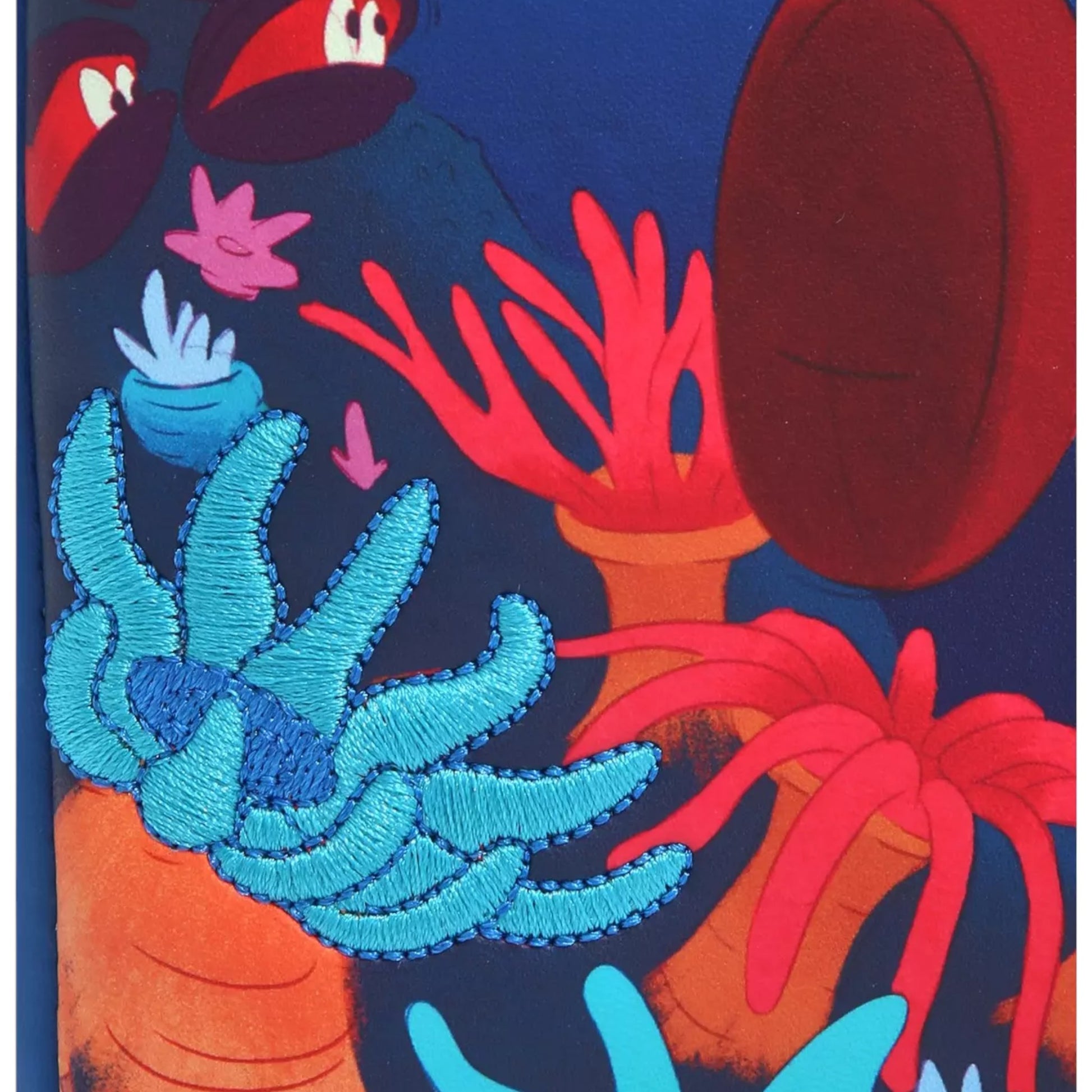 Colorful underwater scene with sea creatures on a dark blue background