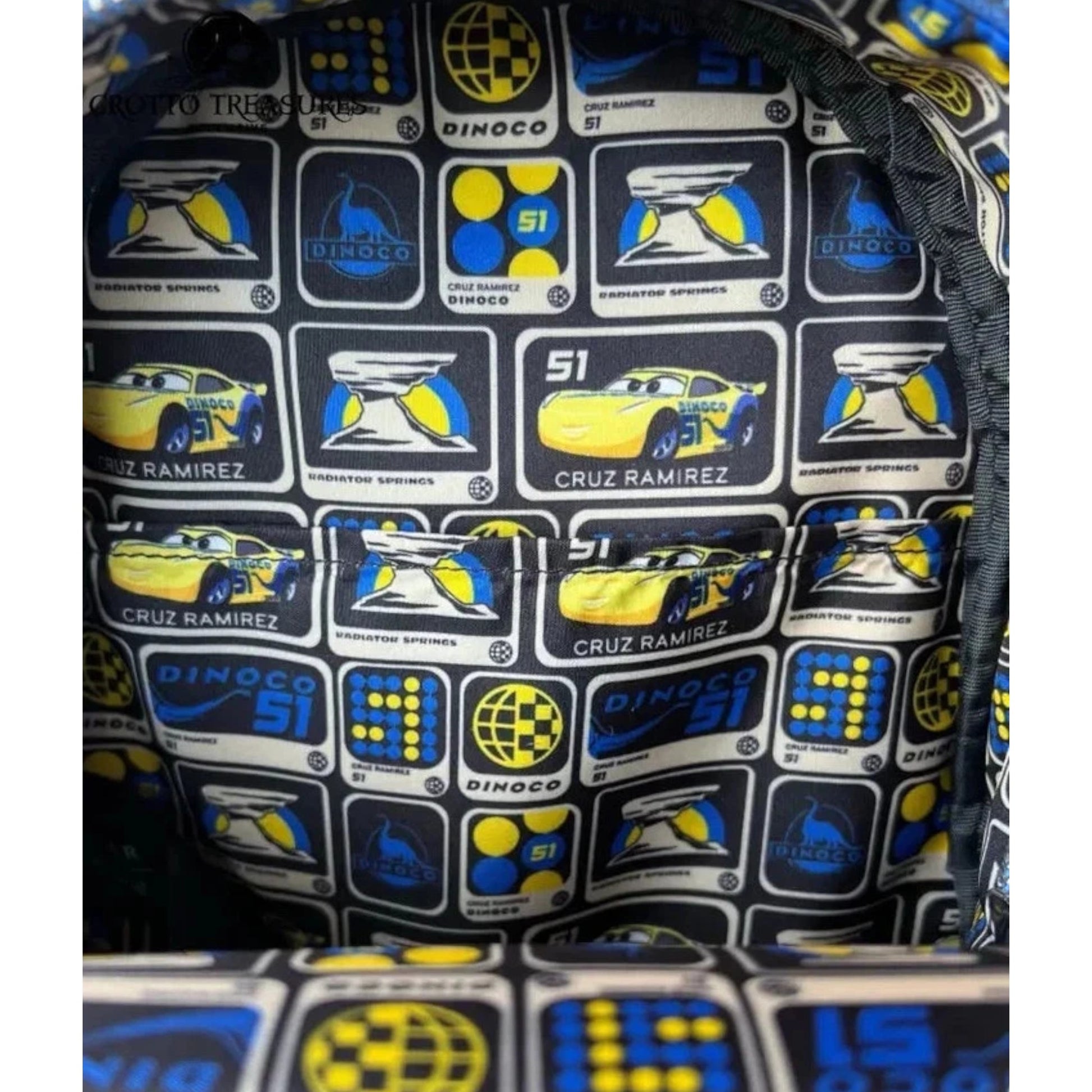 Close-up of onside of Yellow Loungefly Disney Pixar Cars Cruz Ramirez Cosplay Mini Backpack with racing car and logo pattern