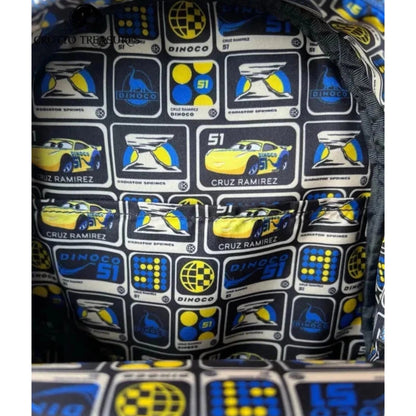Close-up of onside of Yellow Loungefly Disney Pixar Cars Cruz Ramirez Cosplay Mini Backpack with racing car and logo pattern