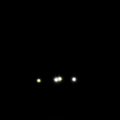 Three small glowing bright headlights on a black background