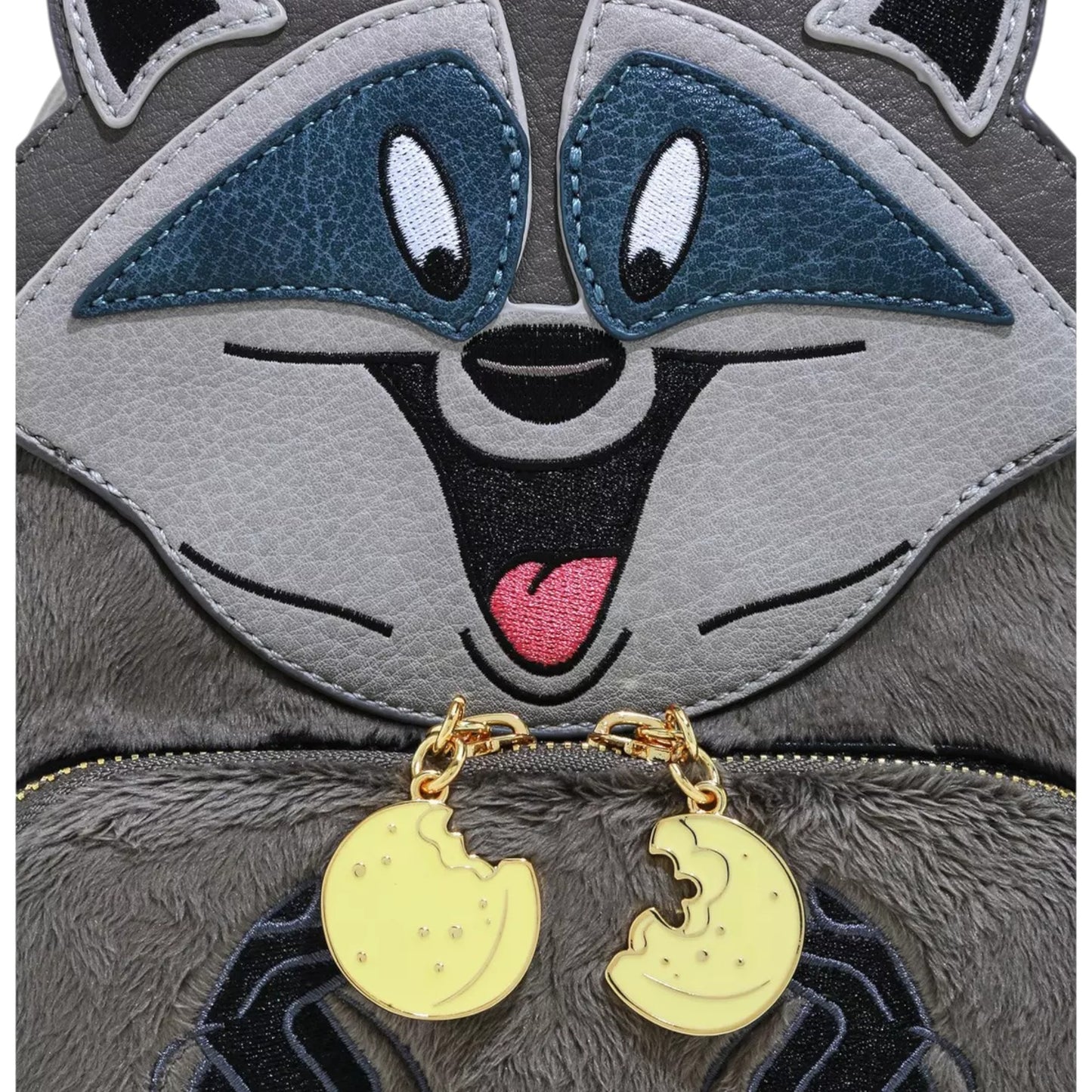 Close-up of Loungefly Disney Pocahontas Meeko Fuzzy Mini Backpack with Meeko character face and hands with gold zipper charm on a white background