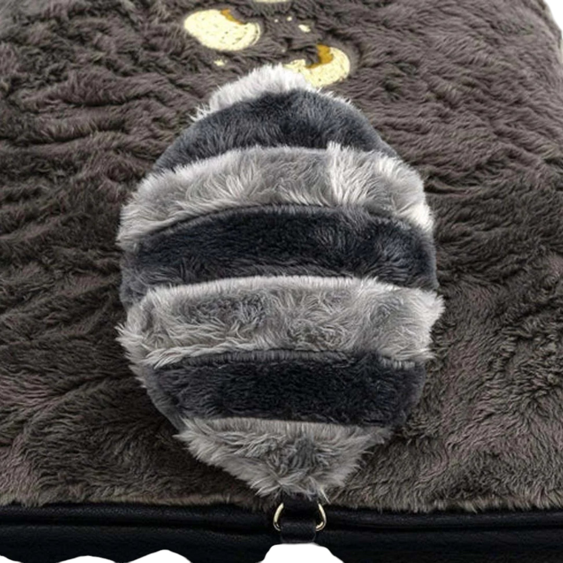 Close-up of Loungefly Disney Pocahontas Meeko Fuzzy Mini Backpack with a plush gray and black striped tail