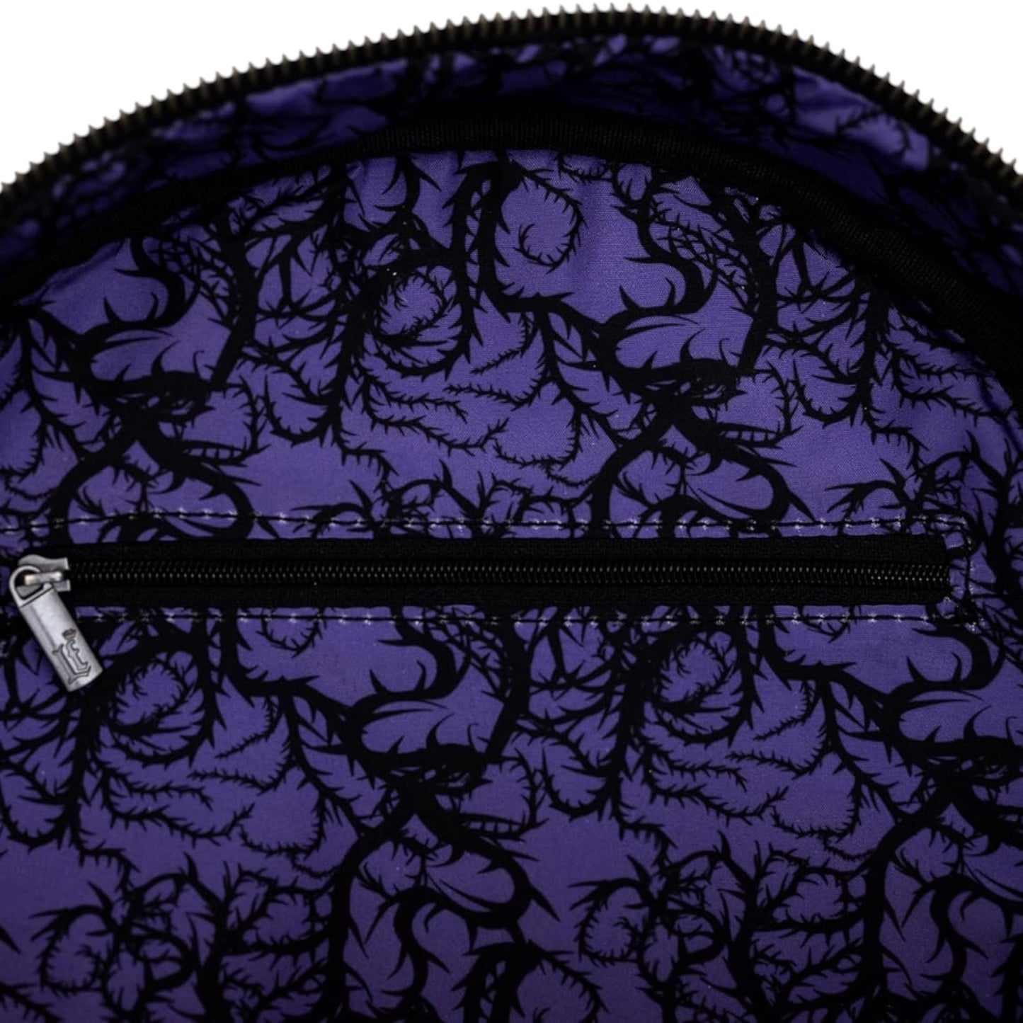 Inside of Purple Loungefly Disney Sleeping Beauty Maleficent Transformation Mini Backpack with purple fabric with black floral pattern and zipper 