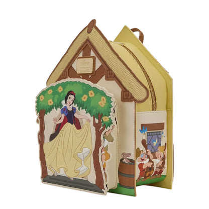 Loungefly Disney Snow White and the Seven Dwarfs Figural Cottage Mini Backpack with Snow White  Character standing on the porch of their cottage on a white background