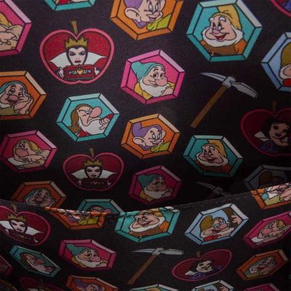 Close-up of inside of Loungefly Disney Snow White and the Seven Dwarfs Figural Cottage Mini Backpack with Snow White and the Seven Dwarfs Characters faces pattern on a black background