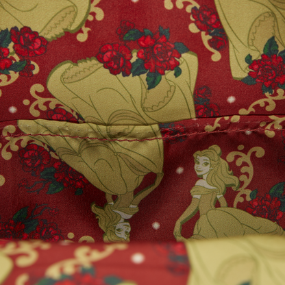 Close-up of the Loungefly Disney Beauty and the Beast Exclusive Belle Floral Mini Backpack with Belle and roses fabric with Beauty and the Beast pattern on a red background