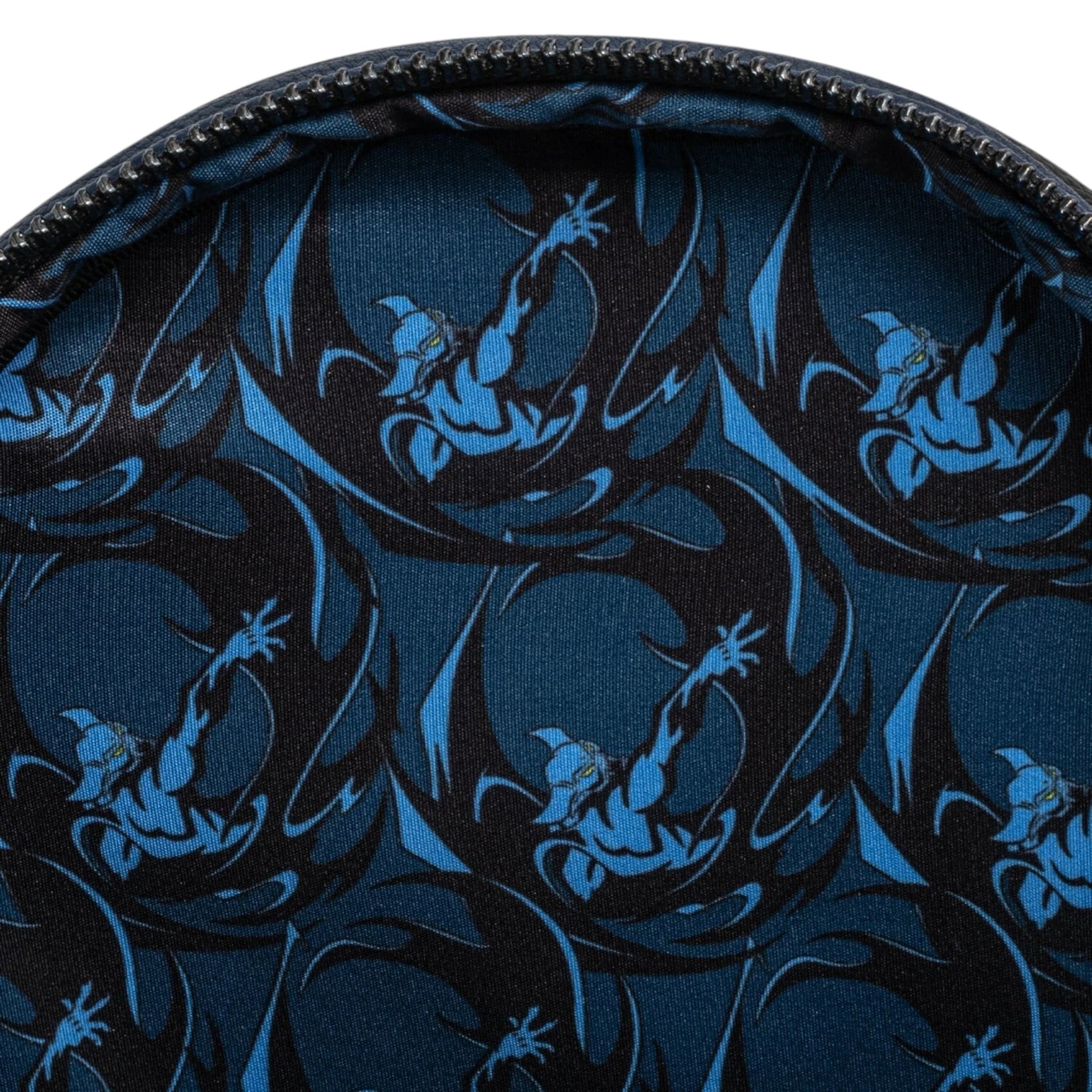 Close-up of inside of  Loungefly Disney Villains Chernabog Cosplay Mini Backpack with a pattern of blue dragons on a black background