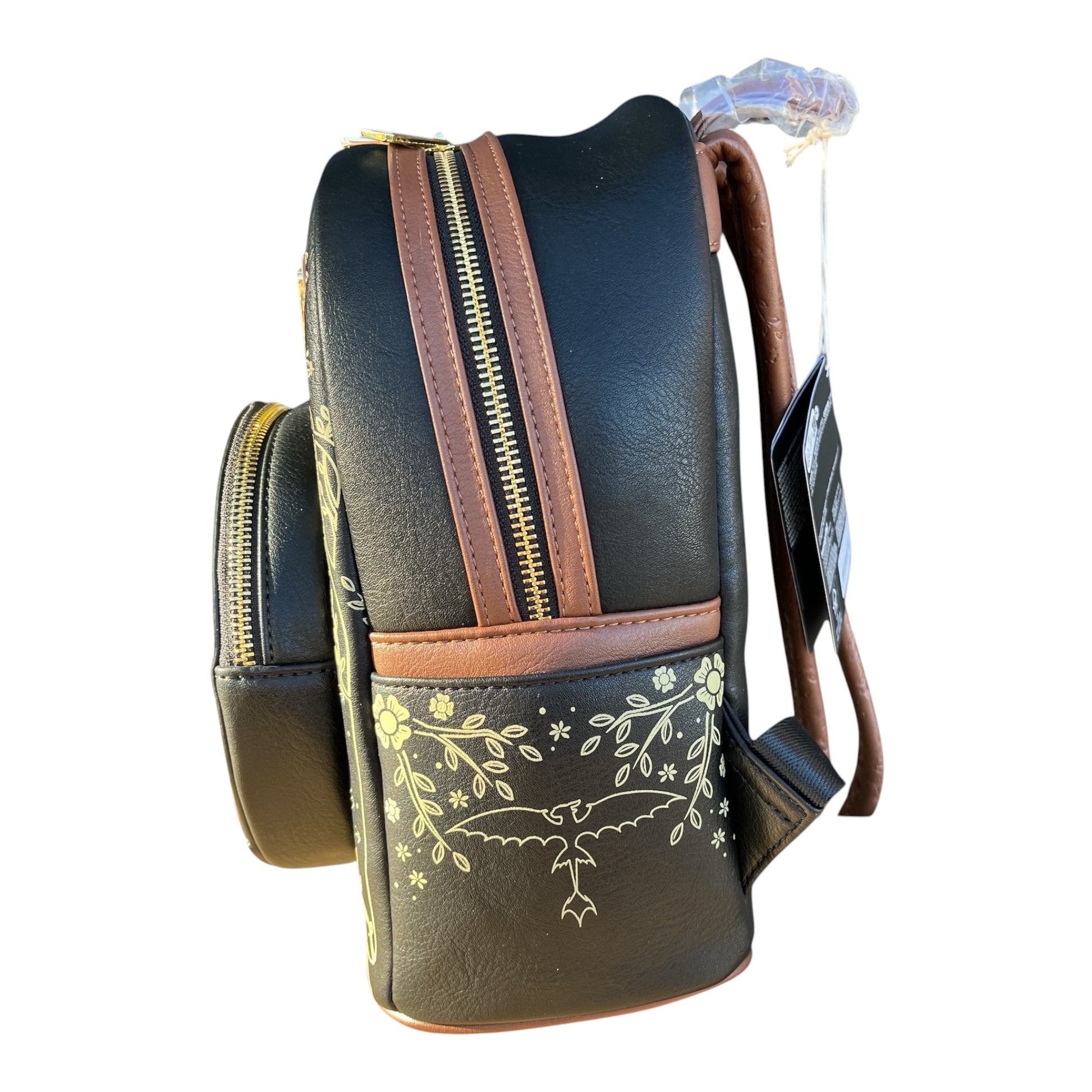 Black Toothless backpack with brown accents and floral design on a white background