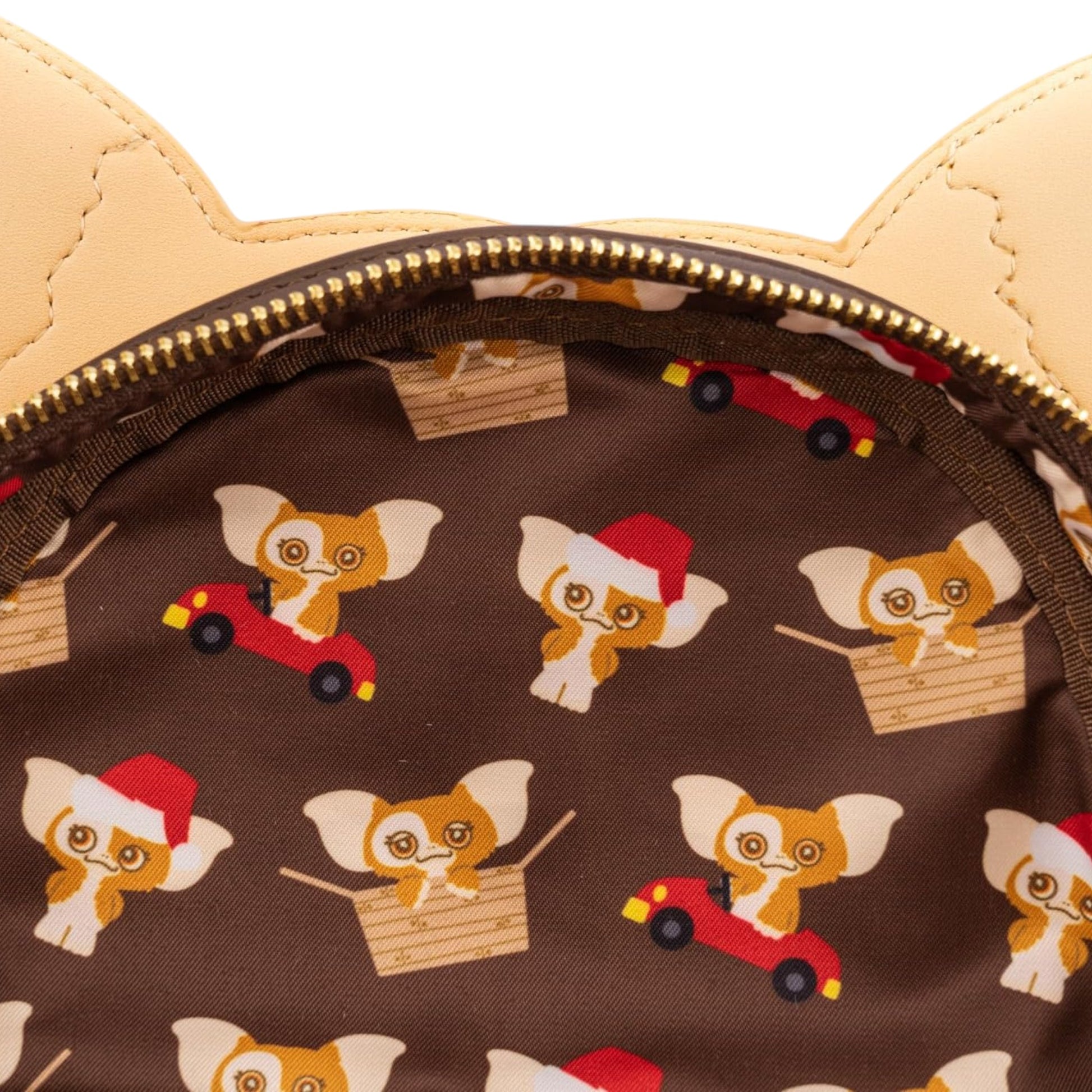Patterned fabric with Gremlins Gizmo Holiday character on a brown background