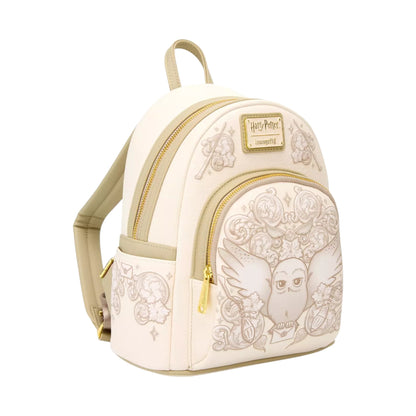 Loungefly Harry Potter Hedwig Ornamental Mini Backpack with Hedwig character design with his wing outstretched with a floral pattern on a white background