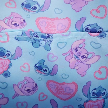 Stitch and angel characters with hearts on a light blue background