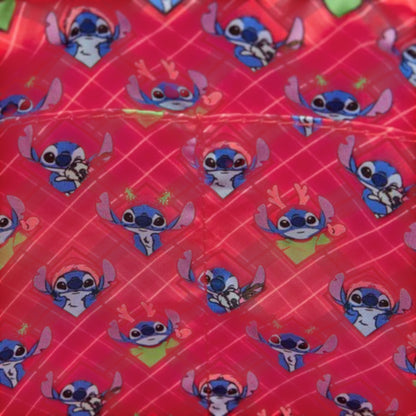 Fabric with stitch character pattern on a red background