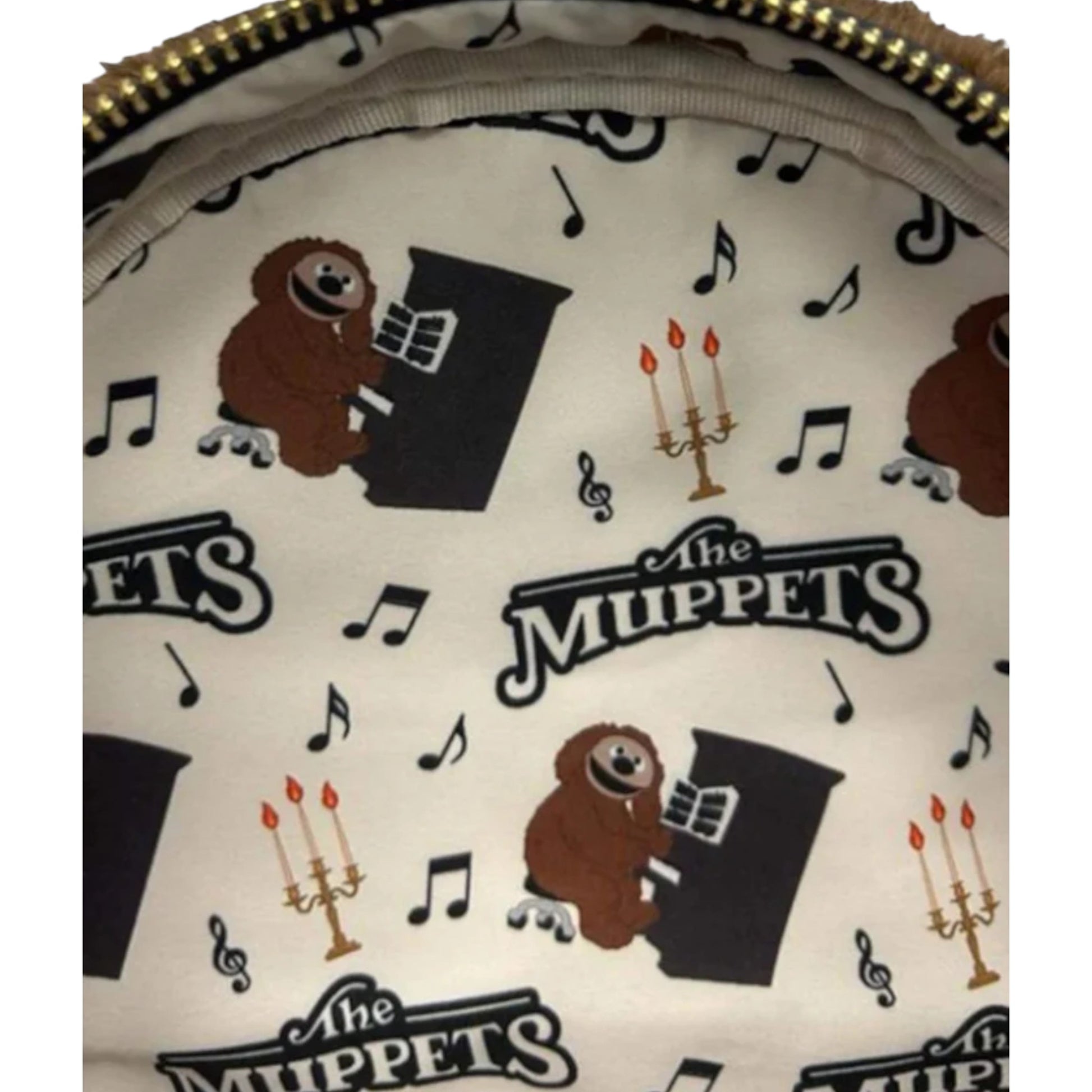 Close-up of a patterned product with 'The Muppets' and Rowlf character  illustrations.