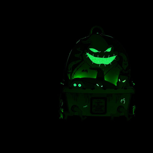 Glowing green Oogie Boogie Lock Shock and Barrel Backpack in a dark setting