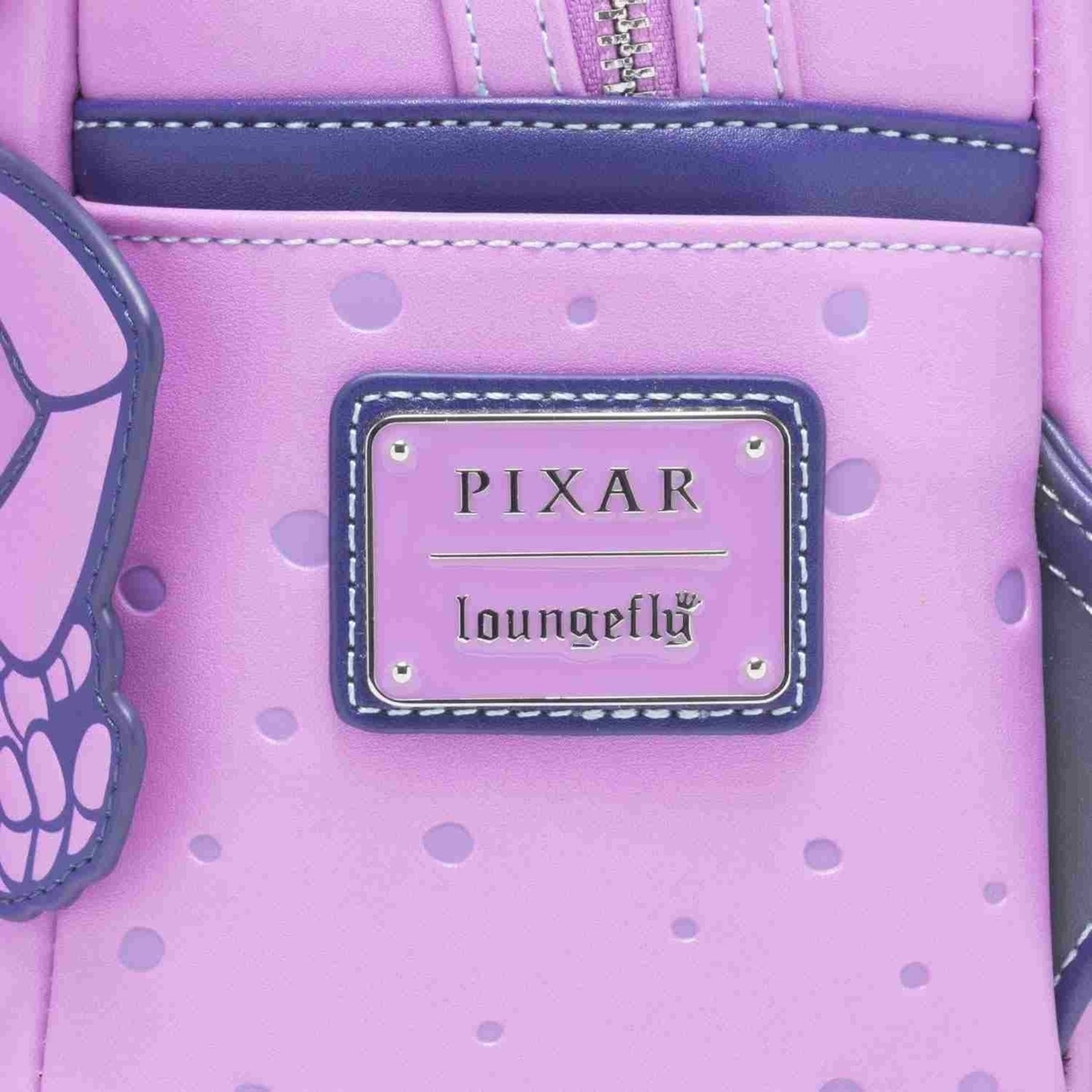 Close-up of Loungefly Pixar A Bug's Life Princess Dot Cosplay Mini Backpack with Pixar Loungefly branded logo