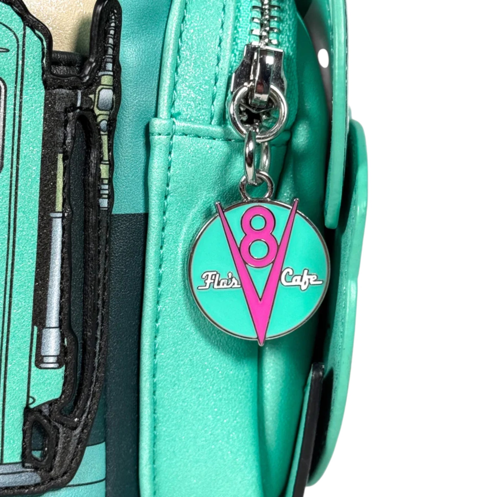 Teal bag with a Flo's Cafe zipper  charm  on a white 