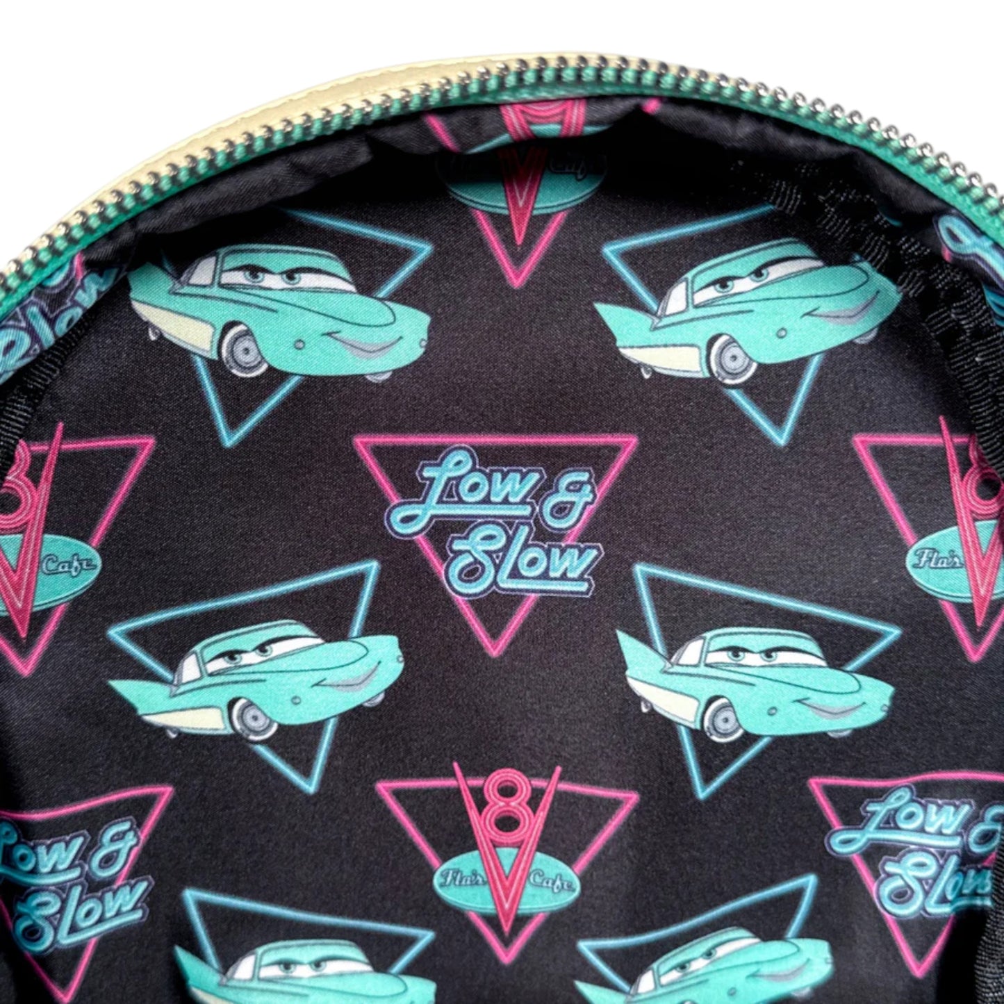 Patterned bag interior with cars and Low & Slow text on a black background