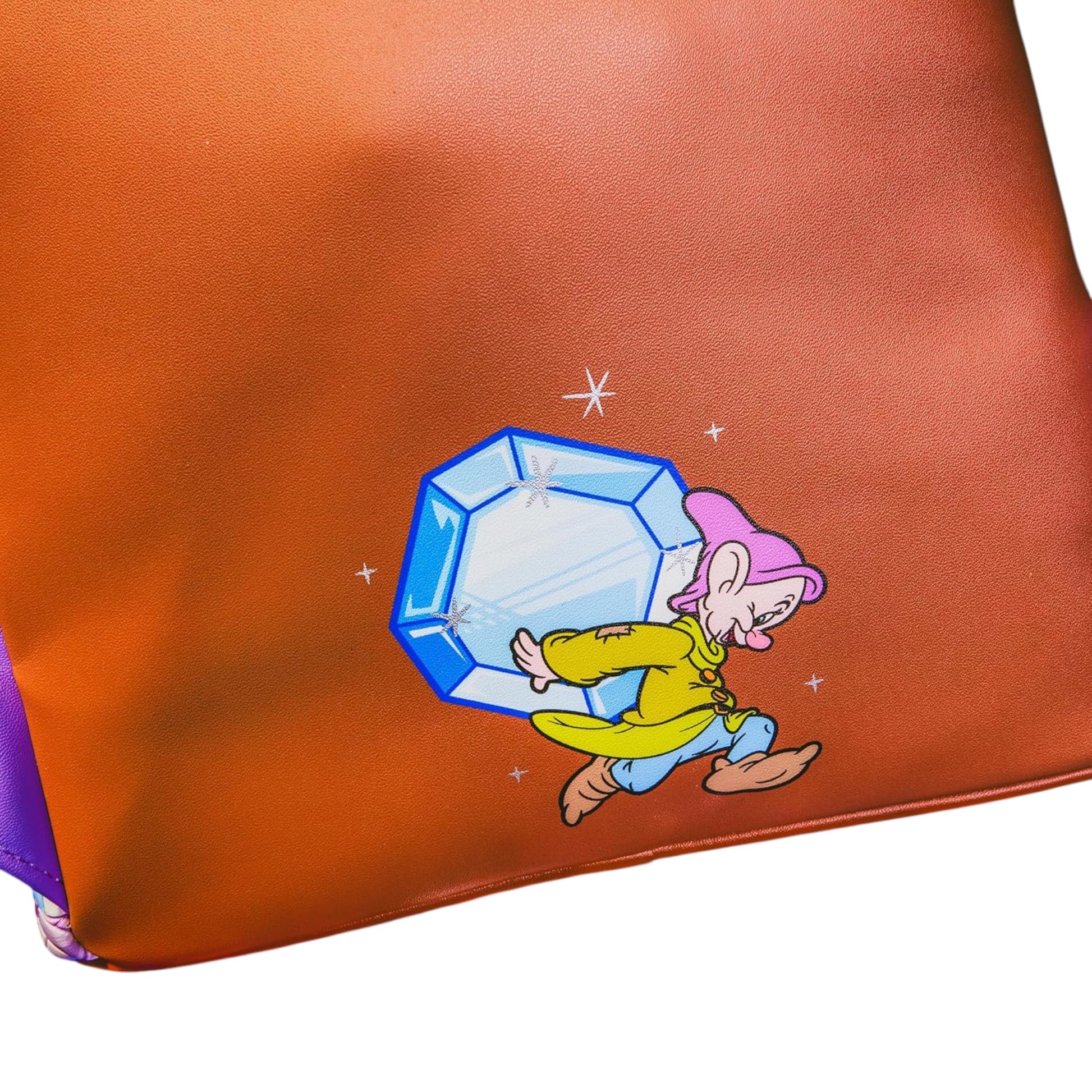 Orange pouch with dopey carrying a diamond character and blue gemstone design