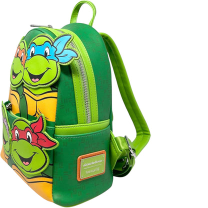 Green backpack with Teenage Mutant Ninja Turtles Squad turtle design on a white background