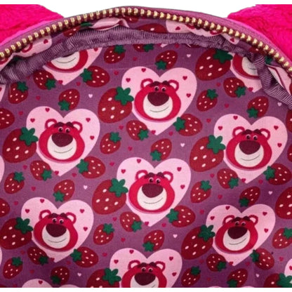 Backpack interior with heart-shaped Lotso teddy bear and strawberry pattern on a purple background
