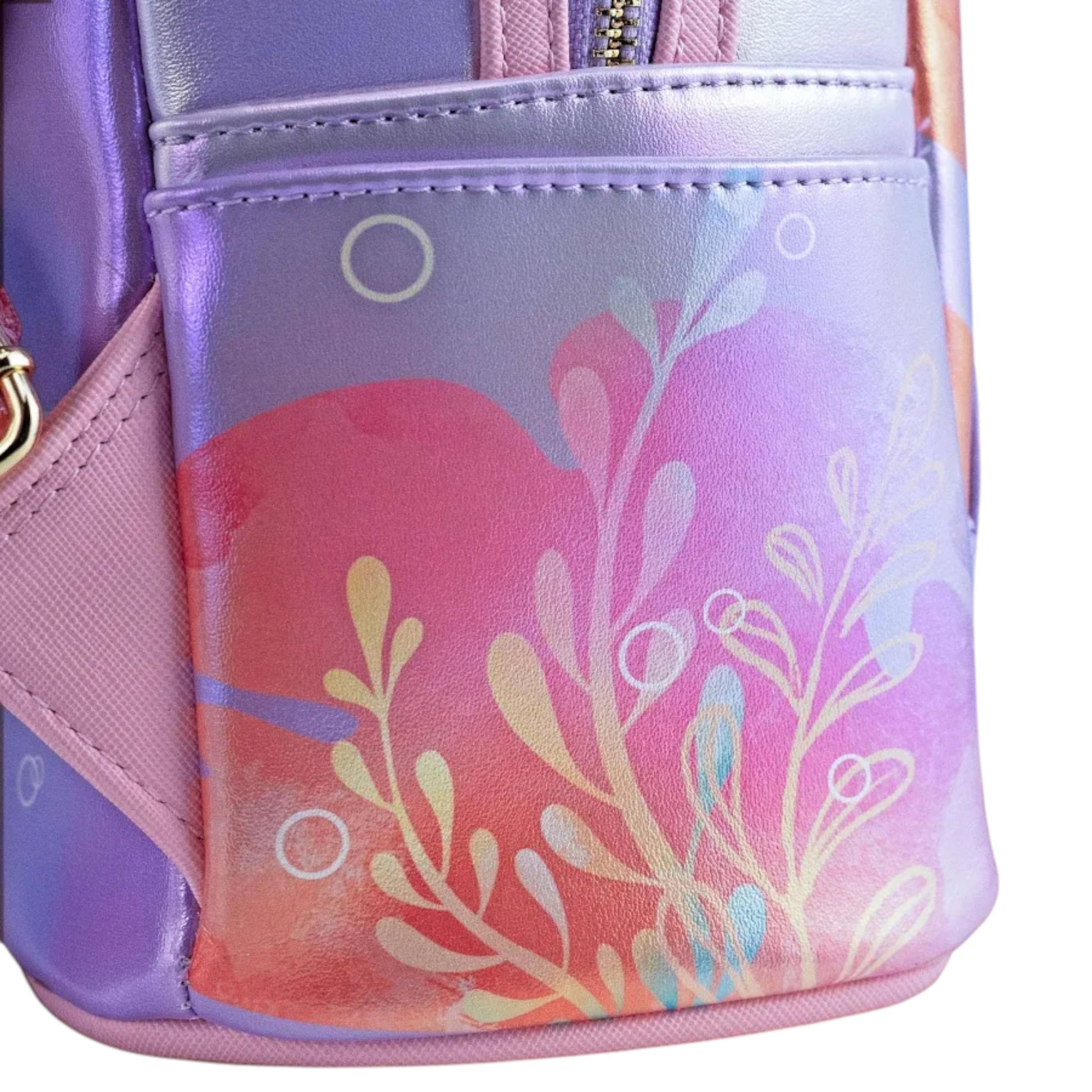 Close-up of Loungefly Disney The Little Mermaid Ariel Soft Floral Mini Backpack with flowers on a white background