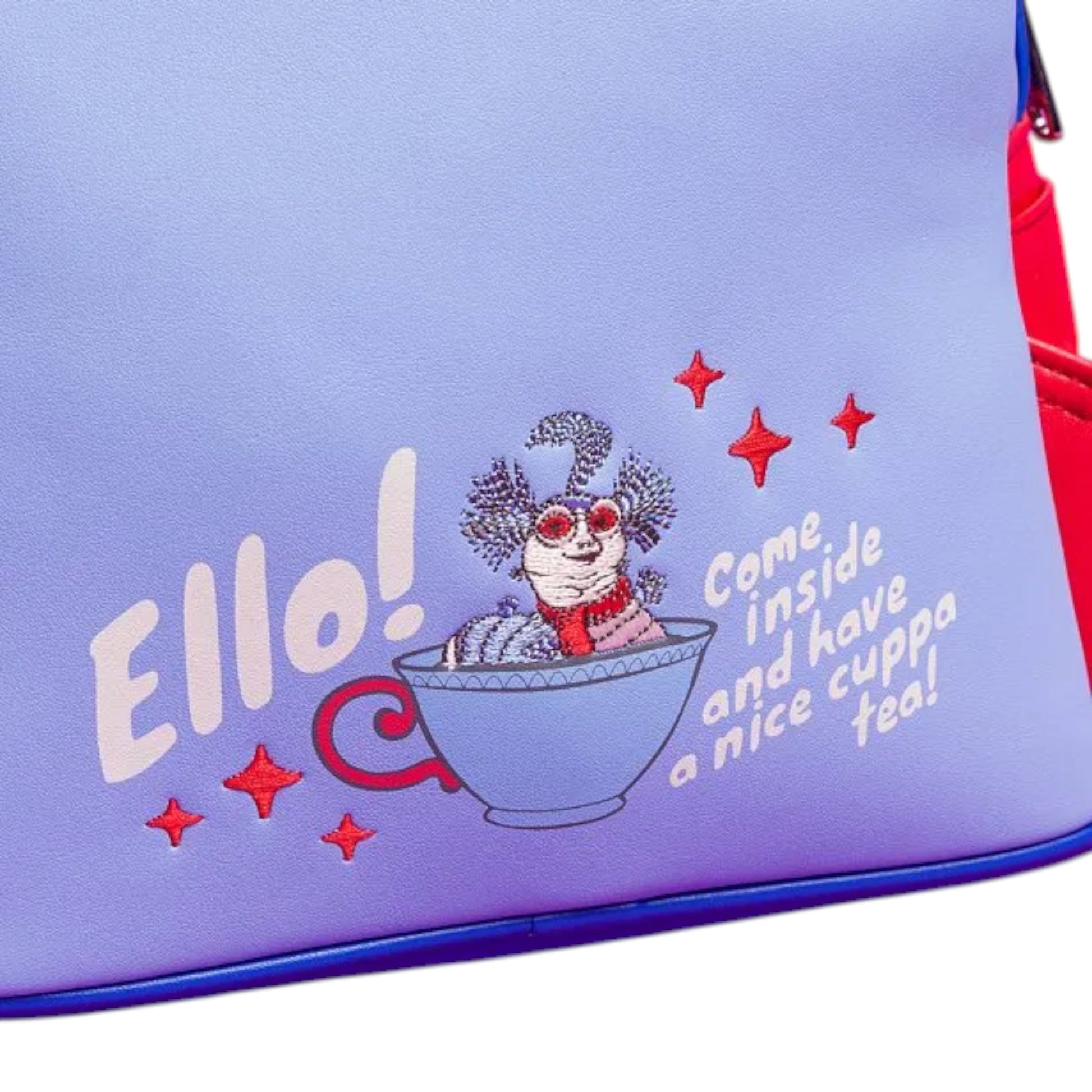 Embroidered design on a Loungefly Labyrinth Worm Cosplay Mini Backpack with an Ello the Worm character in a teacup and text 'Ello! Come inside and have a nice cuppa tea!' text