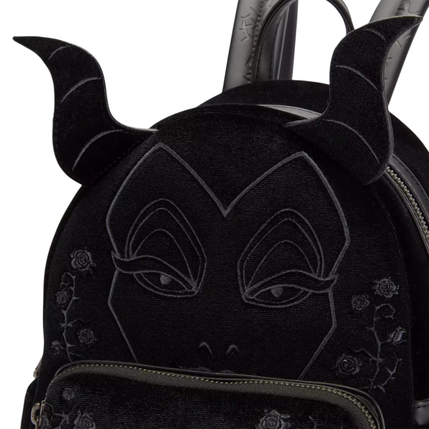 Black backpack with a Maleficent face design and decorative elements on a white background