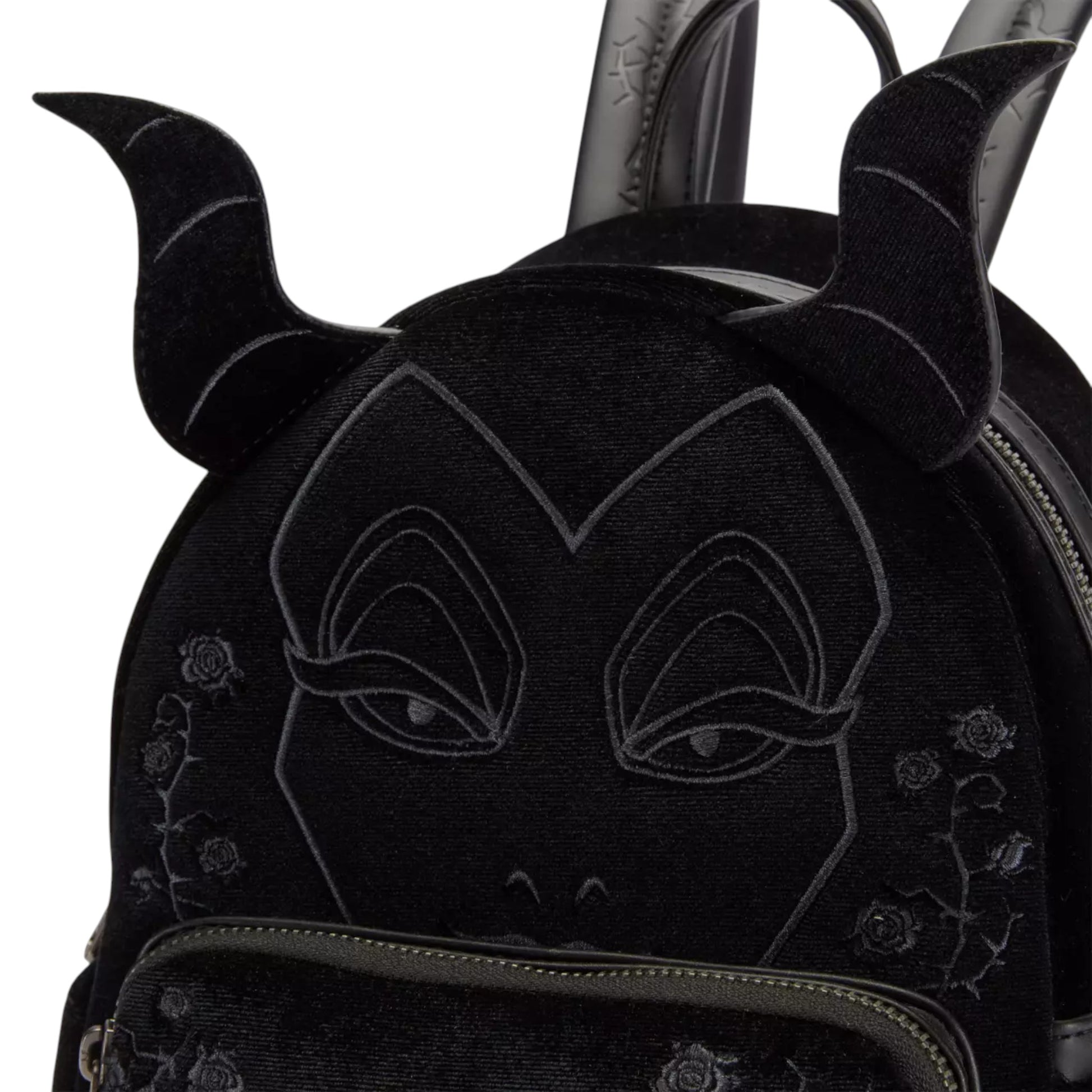 Black backpack with a Maleficent face design and decorative elements on a white background
