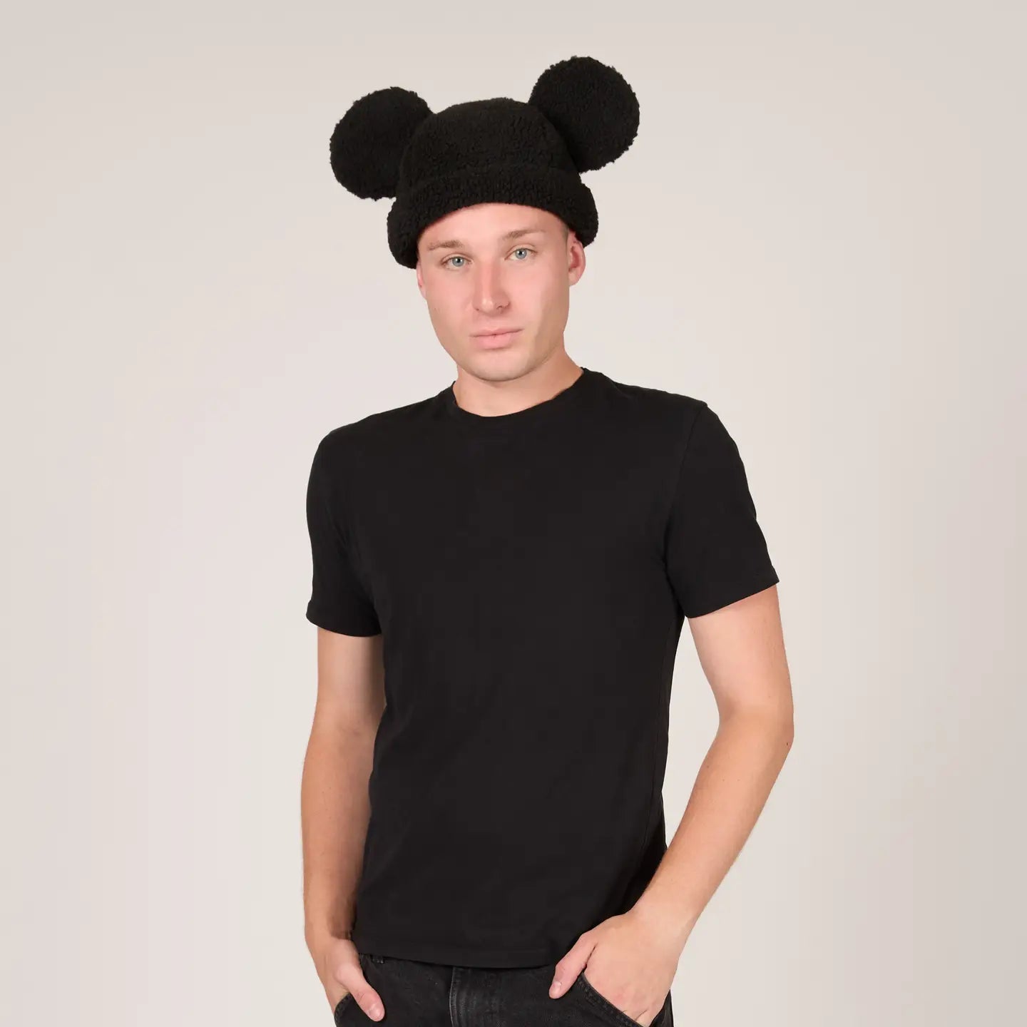 Person wearing a Mickey Sherpa Beanie Classic Black with Mickey ears on a plain background